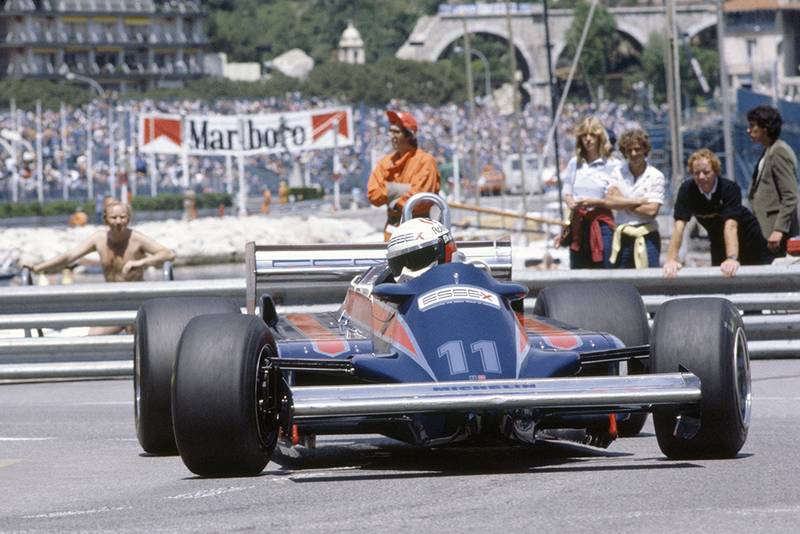 Elio de Angelis in a Lotus 87-Ford Cosworth, he later retired.