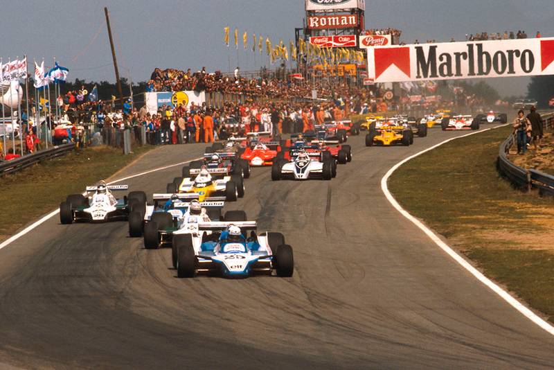 Didier Pironi (Ligier JS11/15 Ford) leads Alan Jones (Williams FW07B Ford), Jacques Laffite (Ligier JS11/15 Ford), Carlos Reutemann (Williams FW07B Ford) and Rene Arnoux (Renault RE20) into the first turn at the start.