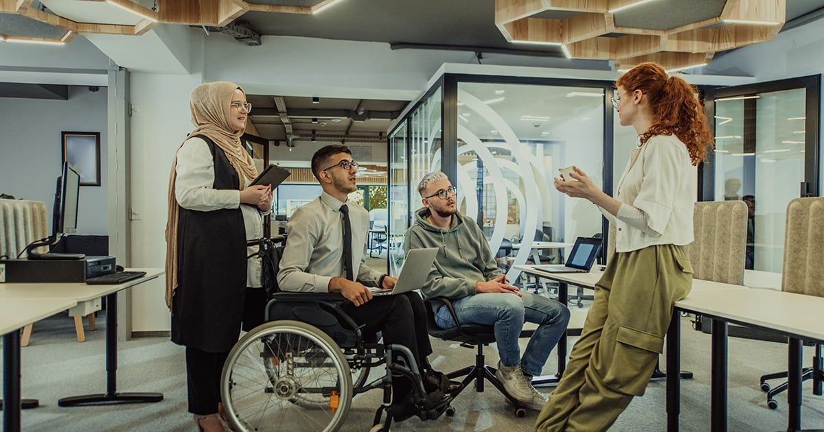 Young group of business people brainstorming together in a startup space, discussing business projects, investments, and solving challenges